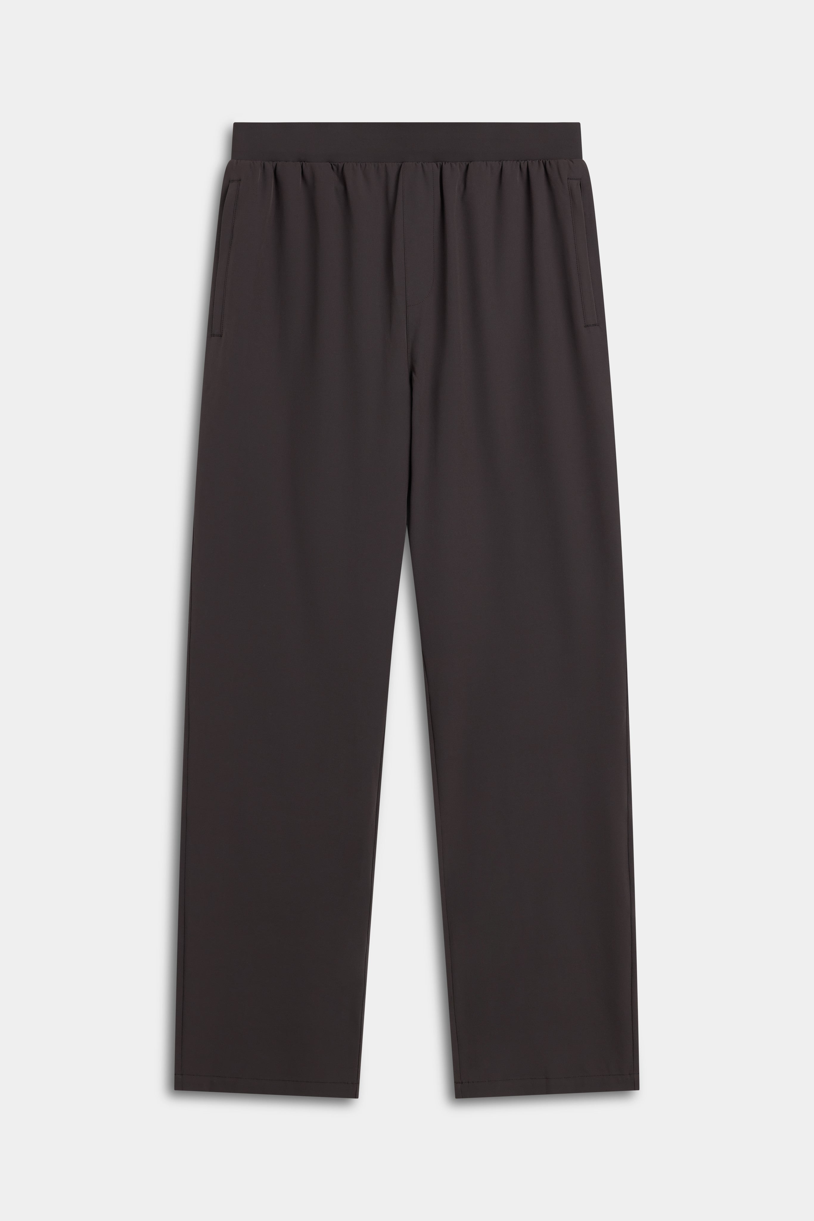 CASPARA Prime Core Pants in espresso brown against a light grey background.